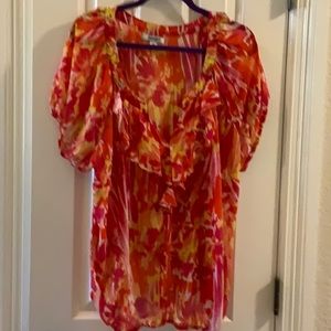 2X old, navy blouse in oranges, pinks, and yellows.